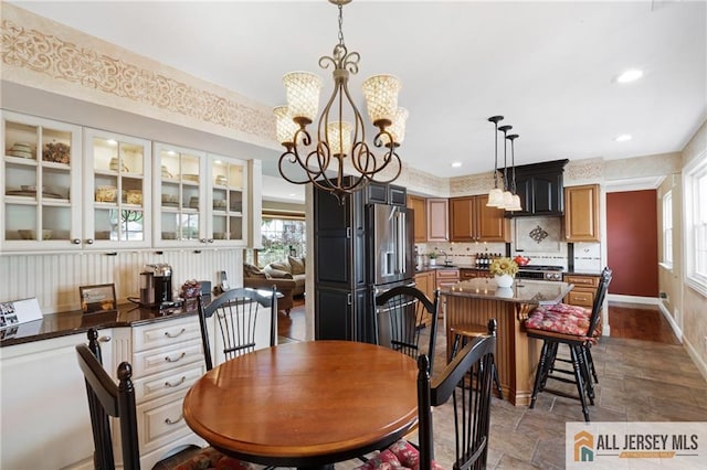 49 Lavender Dr, Edison, NJ 08820 - dining space with a chandelier, plenty of natural light, dark stone finish flooring, and recessed lighting