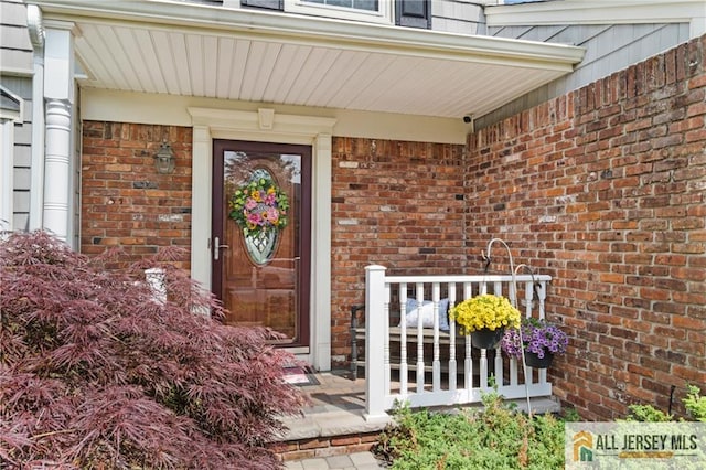 49 Lavender Dr, Edison, NJ 08820 - property entrance with covered porch, brick siding, and a surveillance system