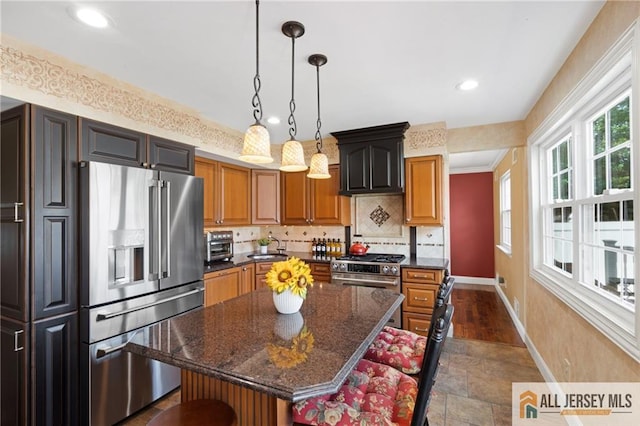 49 Lavender Dr, Edison, NJ 08820 - kitchen with high end appliances, tasteful backsplash, a kitchen island, dark stone finish flooring, and recessed lighting
