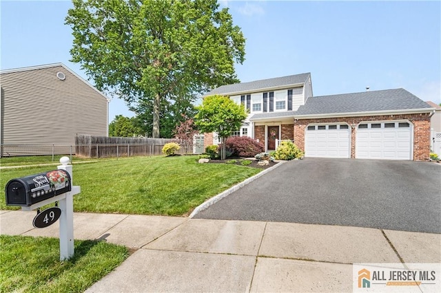 49 Lavender Dr, Edison, NJ 08820 - traditional-style home featuring a garage, brick siding, asphalt driveway, and roof with shingles