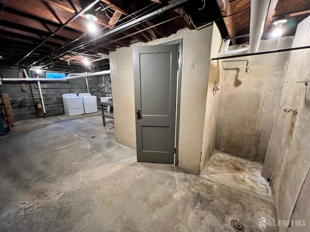 basement with separate washer and dryer