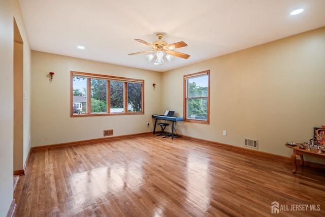 16 London Dr, East Brunswick, NJ 08816 - spare room with plenty of natural light, a ceiling fan, wood finished floors, and recessed lighting