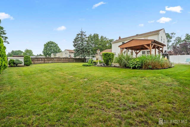 16 London Dr, East Brunswick, NJ 08816 - fenced backyard featuring a gazebo