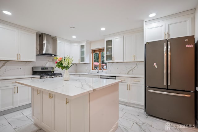 16 London Dr, East Brunswick, NJ 08816 - kitchen featuring stainless steel appliances, wall chimney range hood, light marble finish floors, white cabinets, and recessed lighting