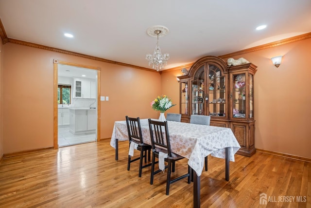 16 London Dr, East Brunswick, NJ 08816 - dining space featuring a chandelier, ornamental molding, light wood-style flooring, and recessed lighting