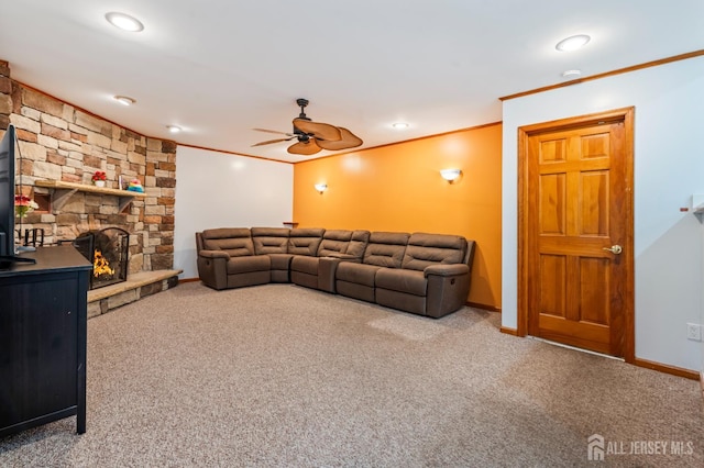 16 London Dr, East Brunswick, NJ 08816 - carpeted living area featuring ornamental molding, ceiling fan, and a stone fireplace