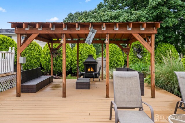 16 London Dr, East Brunswick, NJ 08816 - wooden terrace with a gazebo and an outdoor living space with a fireplace