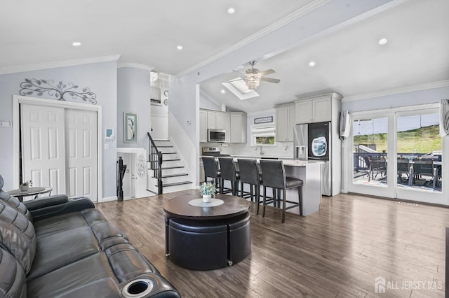 26 Venus Rd, Old Bridge, NJ 08879 - living room with lofted ceiling, a ceiling fan, dark wood-type flooring, stairway, and ornamental molding