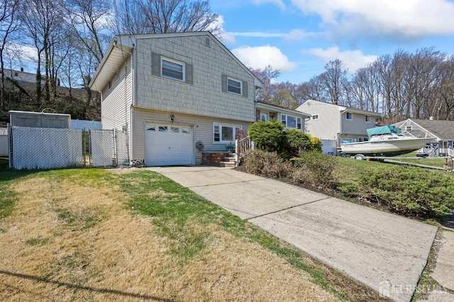 26 Venus Rd, Old Bridge, NJ 08879 - view of side of property with a garage and concrete driveway