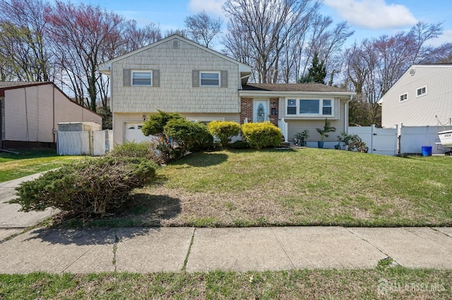 26 Venus Rd, Old Bridge, NJ 08879 - split level home featuring an attached garage and a gate