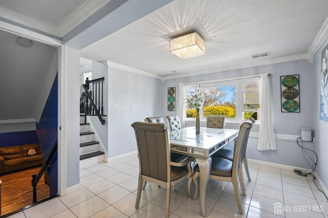 26 Venus Rd, Old Bridge, NJ 08879 - dining area featuring stairs, light tile patterned flooring, baseboards, and ornamental molding