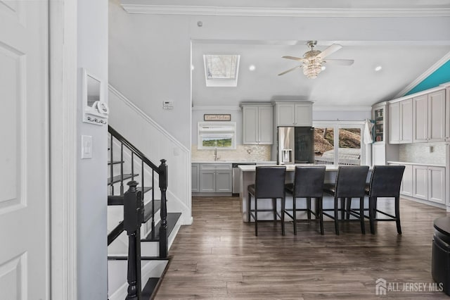 26 Venus Rd, Old Bridge, NJ 08879 - kitchen featuring appliances with stainless steel finishes, a ceiling fan, decorative backsplash, a sink, and lofted ceiling