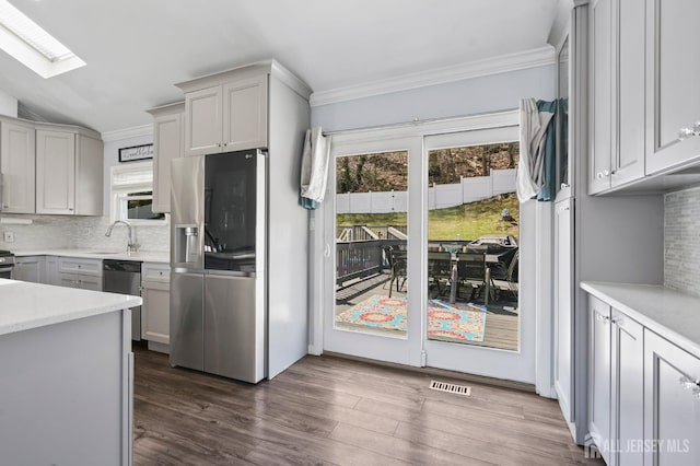 26 Venus Rd, Old Bridge, NJ 08879 - kitchen with stainless steel fridge with ice dispenser, dishwasher, healthy amount of natural light, backsplash, and crown molding