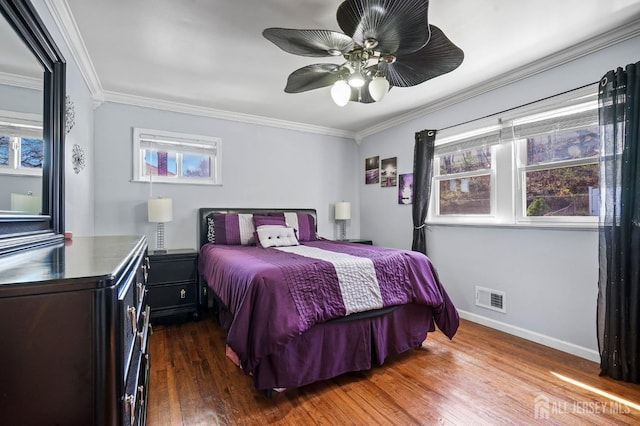 26 Venus Rd, Old Bridge, NJ 08879 - bedroom featuring crown molding, dark wood finished floors, multiple windows, baseboards, and ceiling fan