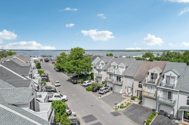 aerial view of residential area with a nearby body of water