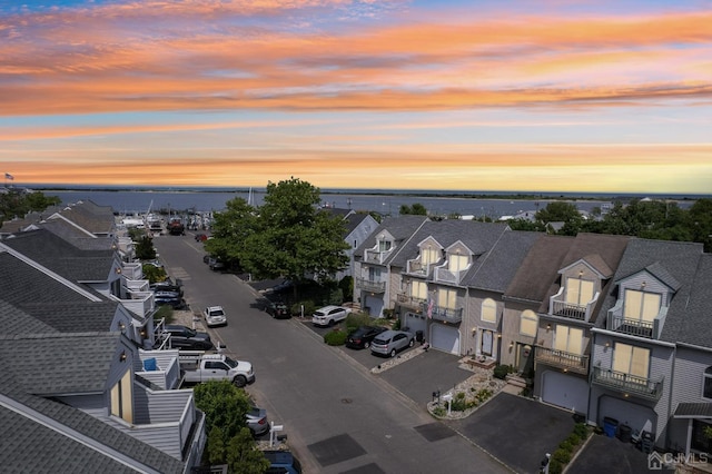aerial view at dusk of a residential view and a water view