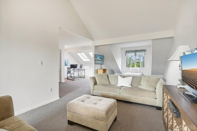 carpeted living room with high vaulted ceiling and a skylight