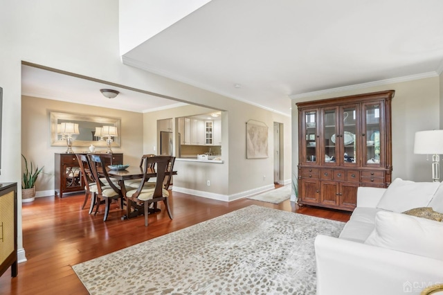 living room with ornamental molding and dark hardwood / wood-style floors