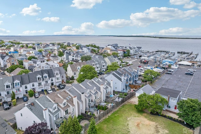 aerial perspective of suburban area featuring a large body of water