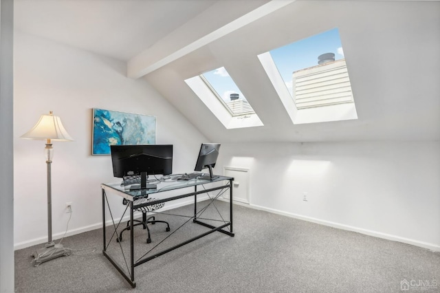 carpeted home office featuring a skylight and baseboards