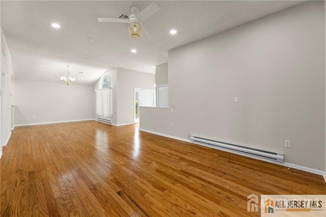 unfurnished living room with light wood-type flooring, baseboards, a baseboard heating unit, and ceiling fan with notable chandelier