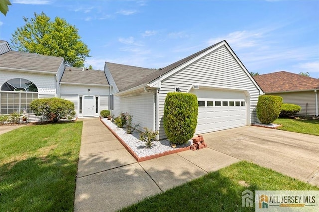 single story home featuring an attached garage, driveway, roof with shingles, and a front lawn