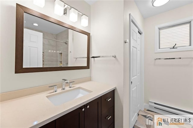 full bathroom with walk in shower, vanity, and a baseboard radiator