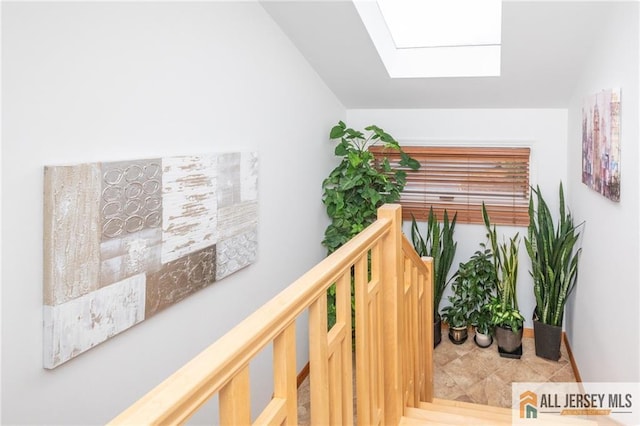 hallway with a skylight