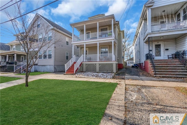 front facade featuring a porch and a front yard