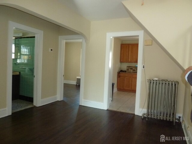 interior space featuring hardwood / wood-style flooring and radiator