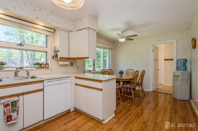 28 Thrush Dr, East Brunswick, NJ 08816 - kitchen featuring dishwasher, light countertops, white cabinets, a peninsula, and a ceiling fan