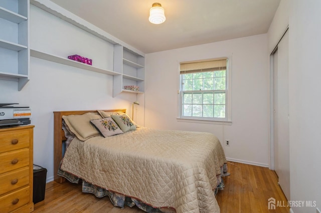 28 Thrush Dr, East Brunswick, NJ 08816 - bedroom featuring wood finished floors, a closet, and baseboards