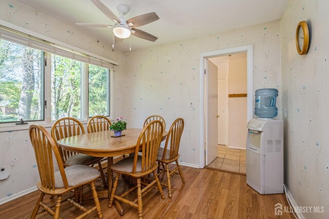 28 Thrush Dr, East Brunswick, NJ 08816 - dining area featuring light wood-style floors, a ceiling fan, and baseboards