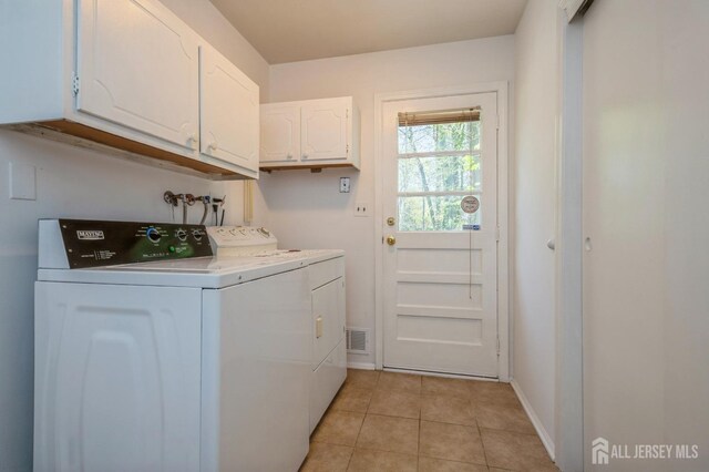 28 Thrush Dr, East Brunswick, NJ 08816 - laundry room with cabinet space, washing machine and dryer, light tile patterned floors, and baseboards