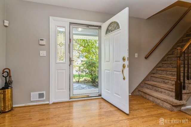 28 Thrush Dr, East Brunswick, NJ 08816 - entrance foyer with stairs, light wood-style flooring, and baseboards