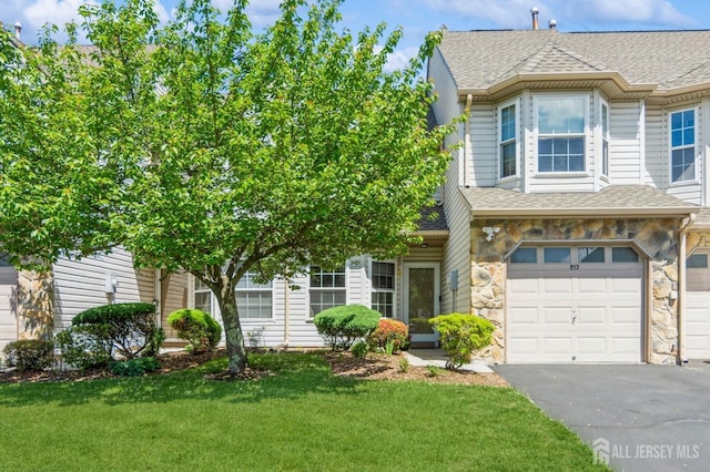 217 Nebula Rd, Piscataway, NJ 08854 - view of front of home featuring stone siding, driveway, a front lawn, and a shingled roof