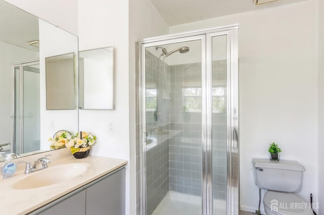 217 Nebula Rd, Piscataway, NJ 08854 - bathroom with a shower stall, toilet, and vanity