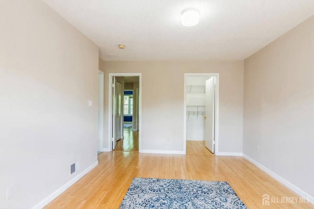 217 Nebula Rd, Piscataway, NJ 08854 - spare room with wood finished floors, baseboards, and a smoke detector