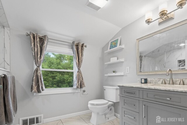243 Donald Ave, Rahway, NJ 07065 - bathroom featuring vaulted ceiling, vanity, marble look tiles, toilet, and baseboards