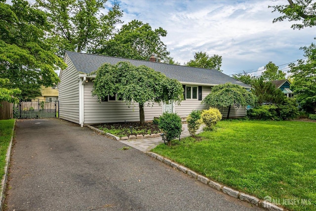 74 Hazelwood Ave, Metuchen, NJ 08840 - view of front facade with asphalt driveway, roof with shingles, and a chimney