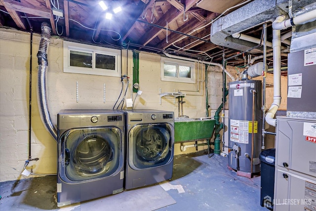 74 Hazelwood Ave, Metuchen, NJ 08840 - washroom with gas water heater and washing machine and dryer