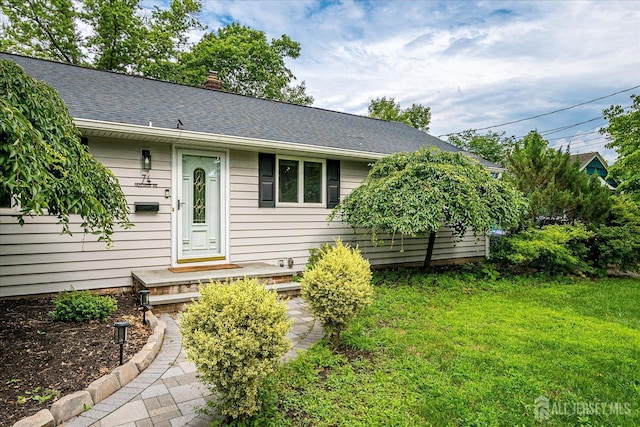 74 Hazelwood Ave, Metuchen, NJ 08840 - view of front of property featuring a front yard, roof with shingles, and a chimney
