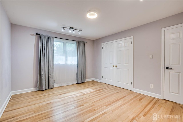 74 Hazelwood Ave, Metuchen, NJ 08840 - unfurnished bedroom with wood finished floors and a closet