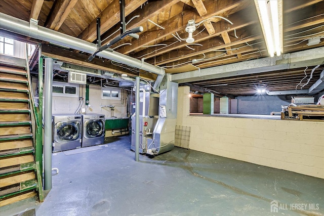 74 Hazelwood Ave, Metuchen, NJ 08840 - unfinished below grade area with heating unit, washer and clothes dryer, and stairs