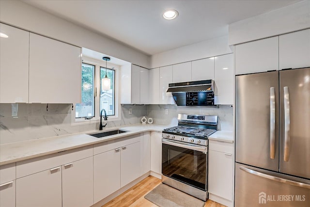 74 Hazelwood Ave, Metuchen, NJ 08840 - kitchen with stainless steel appliances, exhaust hood, white cabinets, and recessed lighting