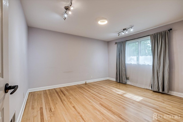 74 Hazelwood Ave, Metuchen, NJ 08840 - unfurnished room featuring track lighting and wood finished floors