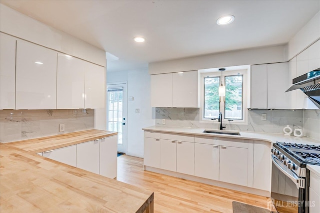 74 Hazelwood Ave, Metuchen, NJ 08840 - kitchen featuring gas stove, modern cabinets, backsplash, white cabinetry, and recessed lighting