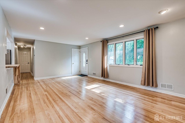 74 Hazelwood Ave, Metuchen, NJ 08840 - unfurnished living room with light wood-type flooring and recessed lighting