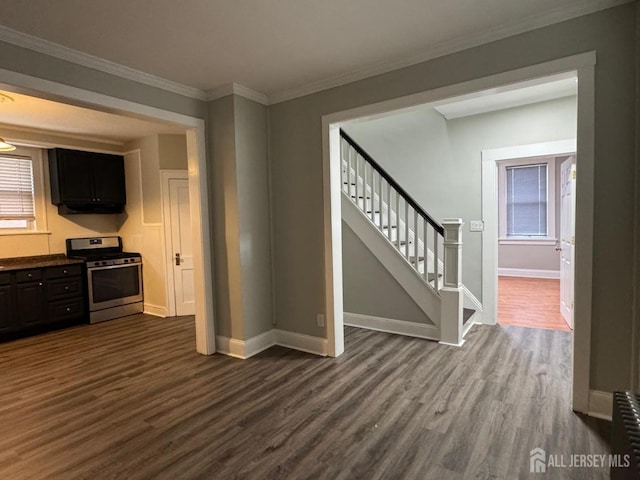 86 Harvey St, New Brunswick, NJ 08901 - kitchen featuring stainless steel range with gas stovetop, dark wood-type flooring, under cabinet range hood, and crown molding