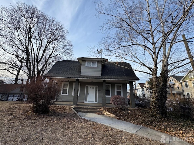 86 Harvey St, New Brunswick, NJ 08901 - bungalow-style house featuring covered porch and roof with shingles